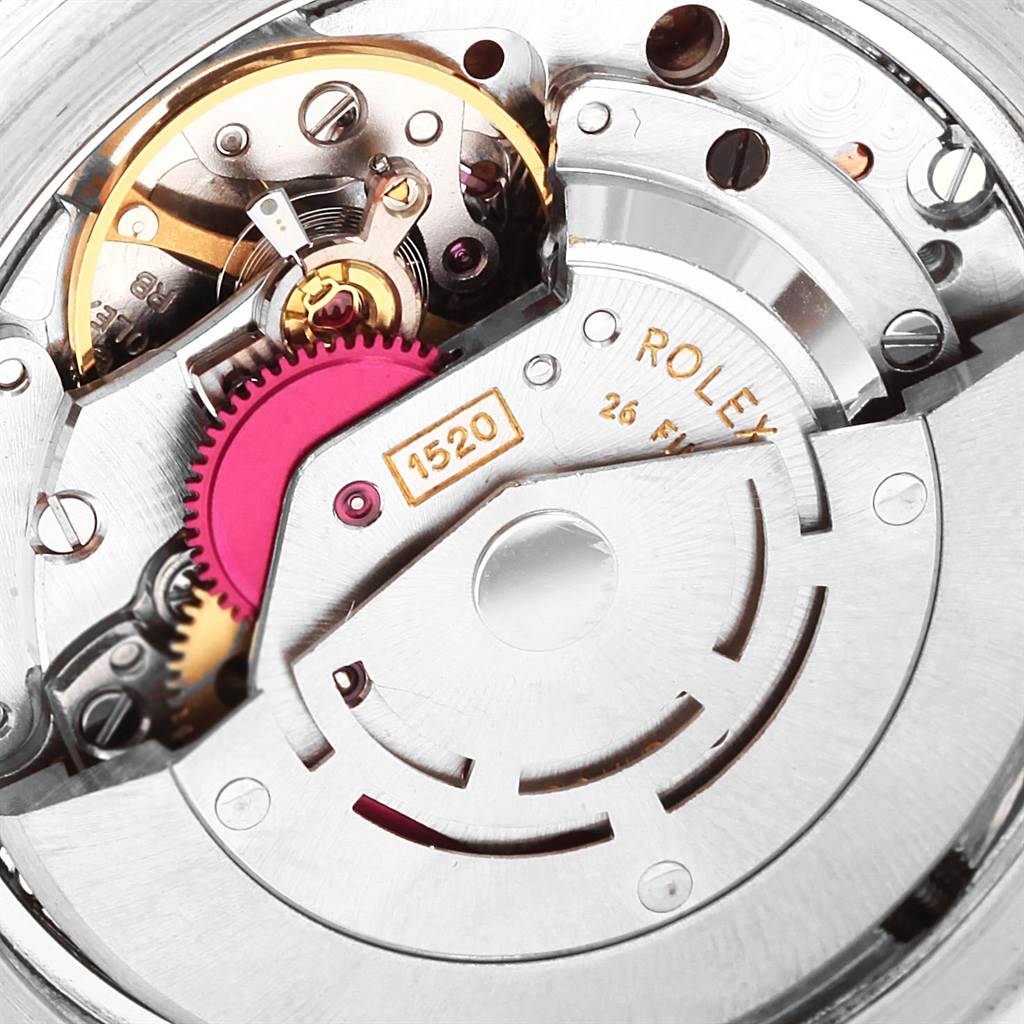 The image shows a close-up of the movement mechanism of a Vintage Collection Rolex watch model 1520.