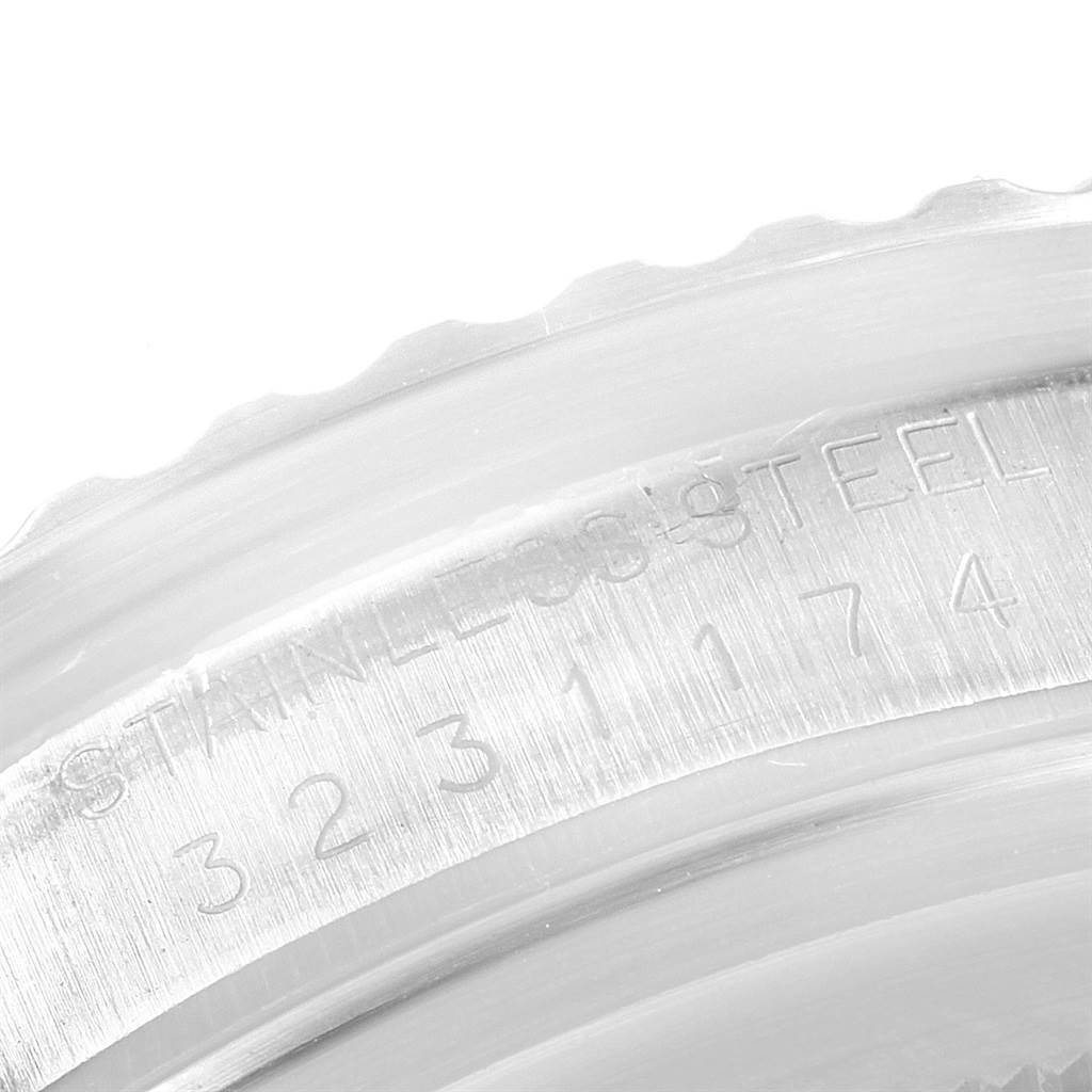 The image shows a close-up of the serial and model number engraved on the stainless steel case
s side of a Rolex Vintage Collection 5513 Men
s Stainless Steel Black Dial 5513 Men
s Stainless Steel Black Dial watch.