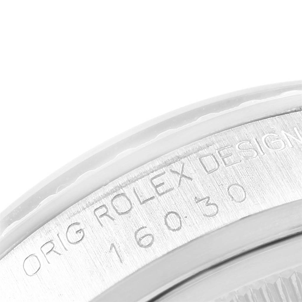 The image shows a close-up angle of the Rolex Vintage Collection 16030 Men's Stainless Steel Black Dial 16030 Men's Stainless Steel Black Dial model's engraved bezel and case.
