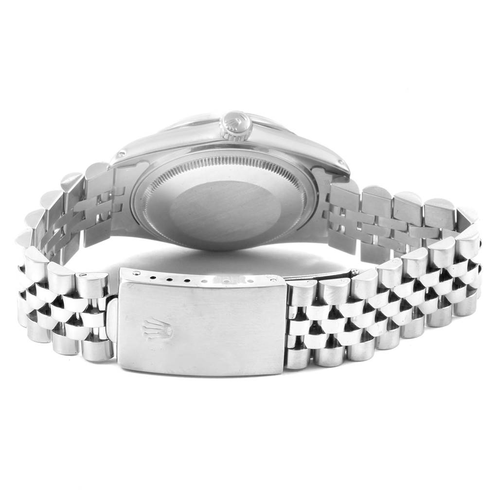 The image shows the Vintage Collection Rolex watch from the back, highlighting the case back and the bracelet clasp.