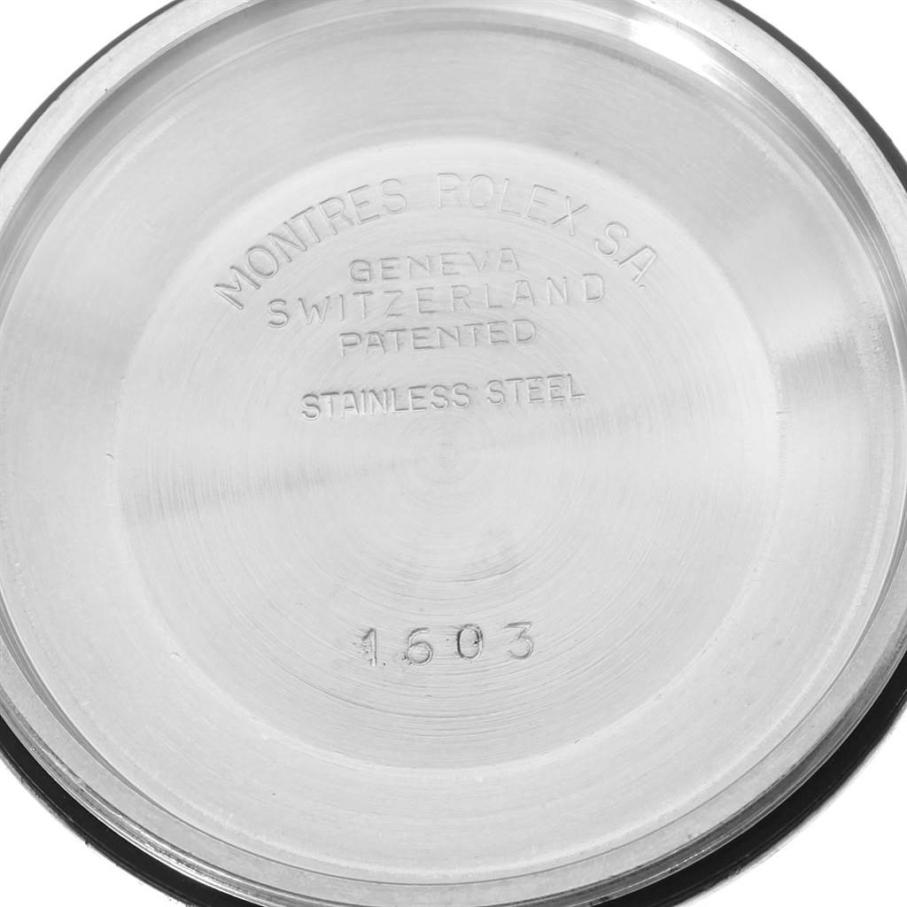 This shows the inside case back of a Rolex Vintage Collection 1603 Men's Stainless Steel Silver Dial 1603 Men's Stainless Steel Silver Dial watch, displaying engravings and model number.