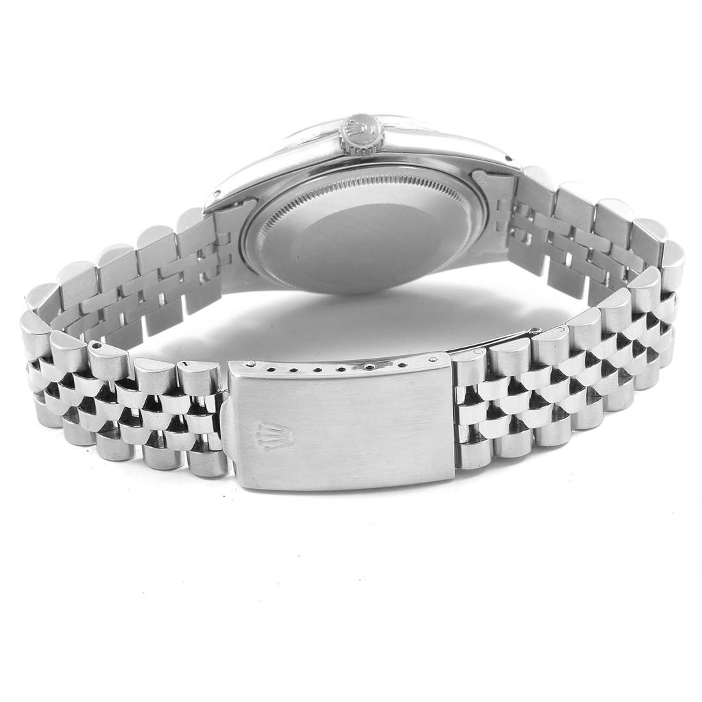 The image shows the backside of the Rolex Vintage Collection 1603 Men's Stainless Steel Silver Dial 1603 Men's Stainless Steel Silver Dial watch, highlighting its clasp, bracelet, and case back.