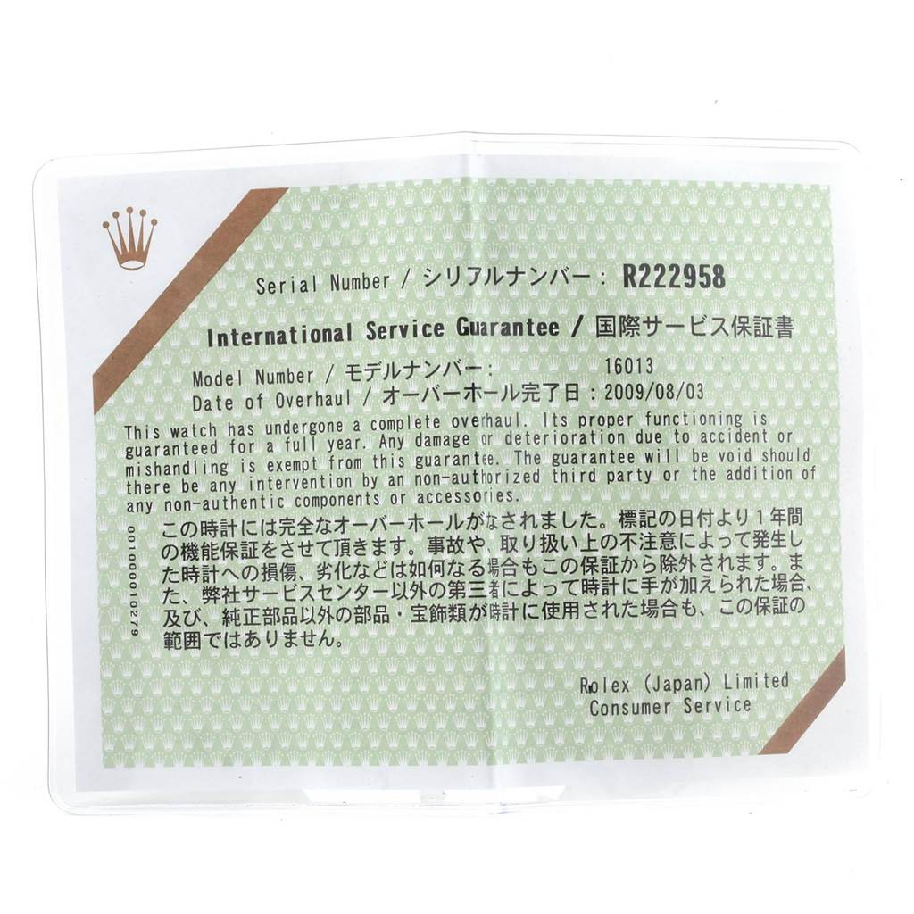 The image shows a close-up of an International Service Guarantee card for the Rolex Vintage Collection 16013 Men's Stainless Steel White Dial 16013 Men's Stainless Steel White Dial model.