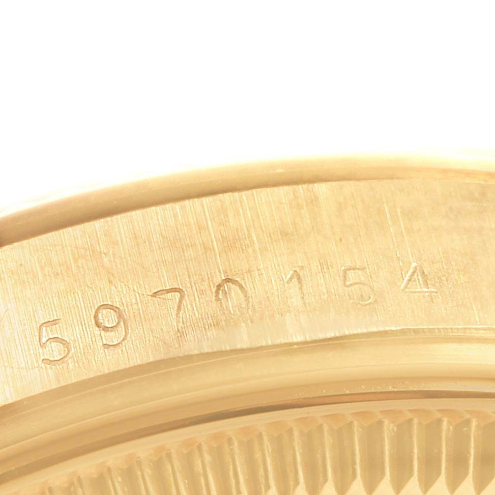 The image shows a close-up of the serial number engraved on the case edge of a Rolex Vintage Collection 1501 Men's Yellow Gold Champagne Dial 1501 Men's Yellow Gold Champagne Dial watch.