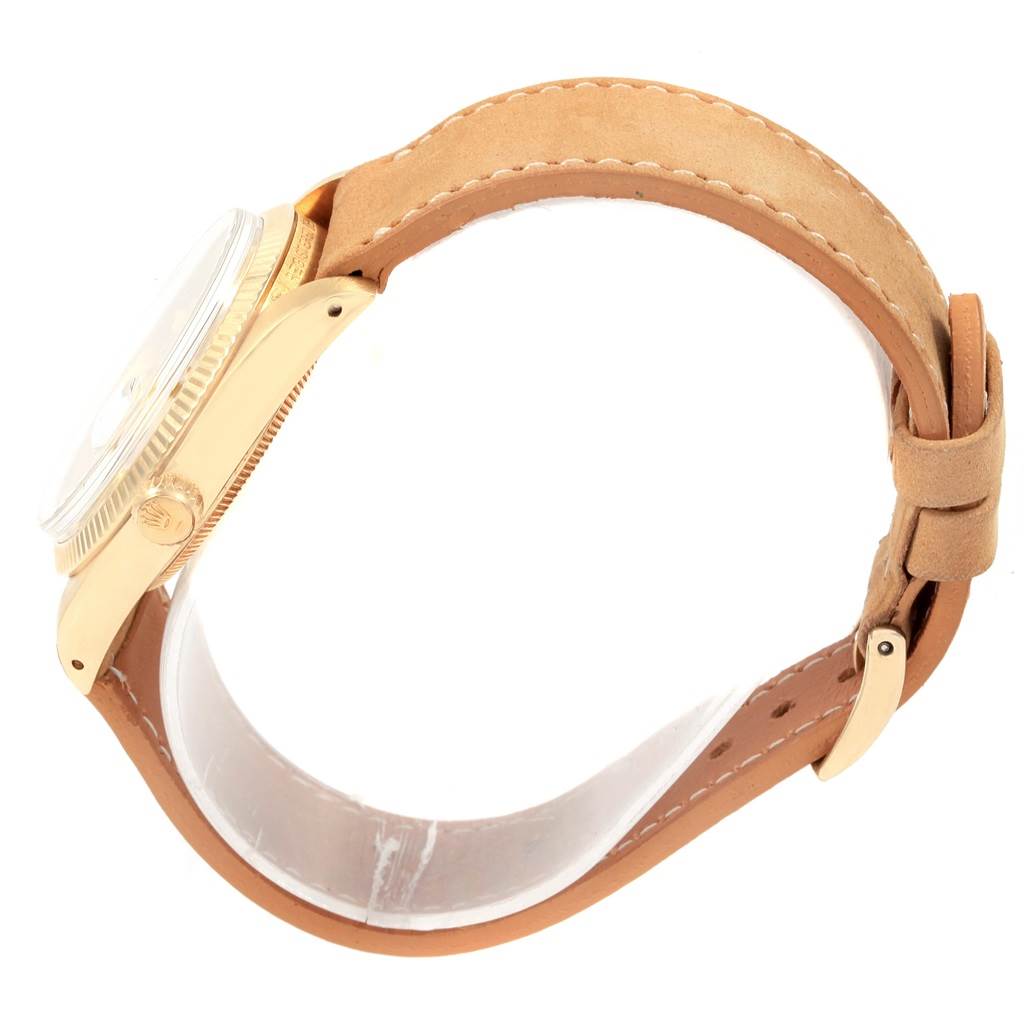 The image shows a side view of the Rolex Vintage Collection 1501 Men's Yellow Gold Champagne Dial 1501 Men's Yellow Gold Champagne Dial watch, focusing on its case, crown, and leather strap with buckle.