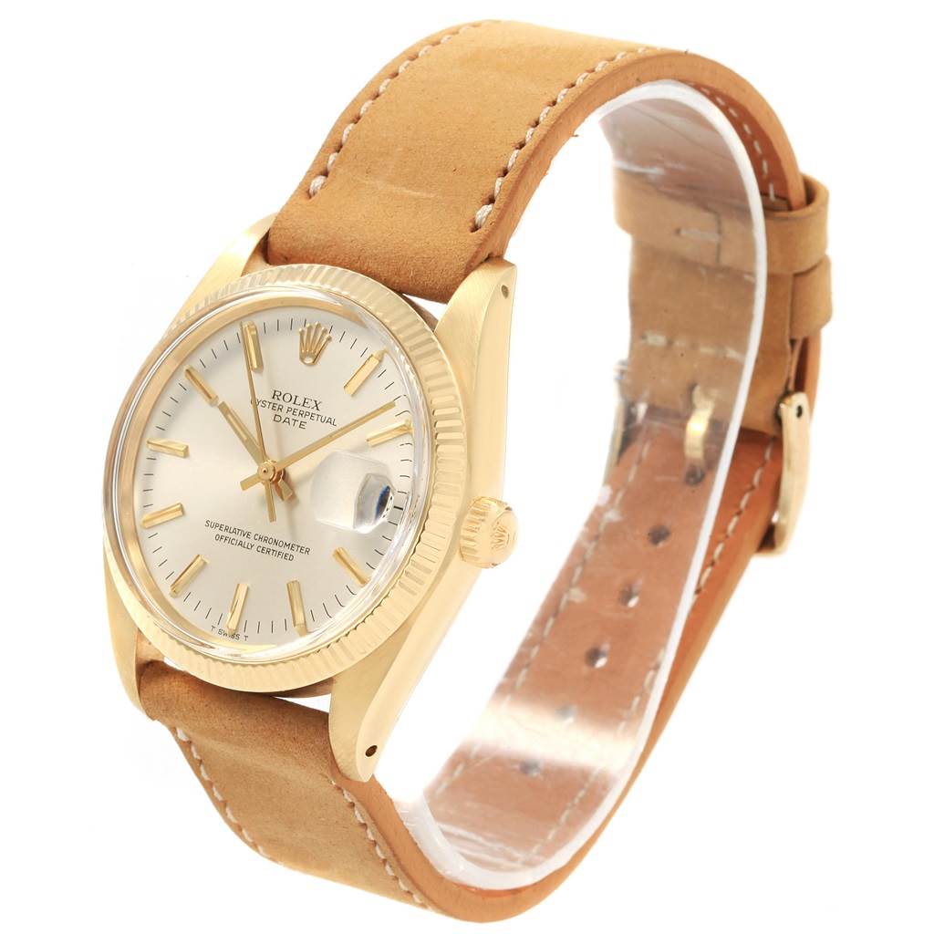This Rolex Vintage Collection 1501 Men's Yellow Gold Champagne Dial 1501 Men's Yellow Gold Champagne Dial watch is shown at a three-quarter angle, highlighting the face, bezel, crown, and leather strap.
