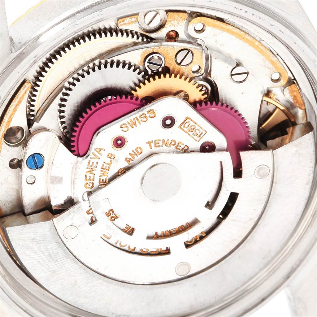 This close-up image shows the intricate inner mechanisms of the Rolex Vintage Collection 1601 Men's Steel and Gold (two tone) Silver Dial 1601 Men's Steel and Gold (two tone) Silver Dial watch.
