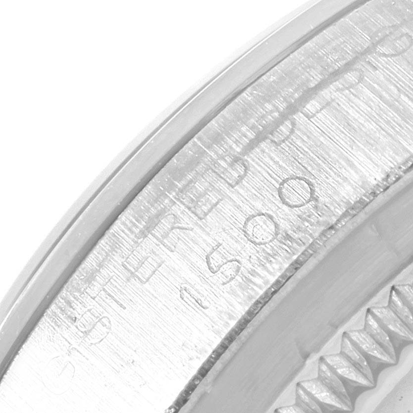 This close-up image showcases the engraved edge of the bezel on a Rolex Vintage Collection 1500 Men's Stainless Steel Silver Dial 1500 Men's Stainless Steel Silver Dial model watch.