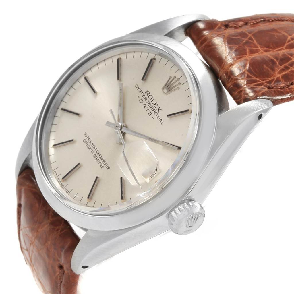 This image shows a Rolex Vintage Collection 1500 Men's Stainless Steel Silver Dial 1500 Men's Stainless Steel Silver Dial watch at an angle highlighting the dial, bezel, crown, and leather strap.