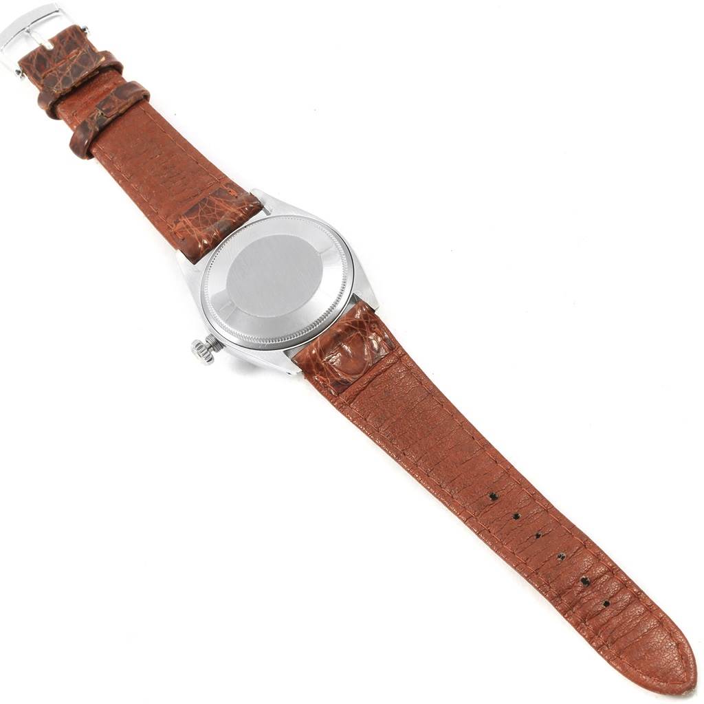 This image shows the backside and brown leather strap of a Rolex Vintage Collection 1500 Men's Stainless Steel Silver Dial 1500 Men's Stainless Steel Silver Dial watch, with the case back visible.