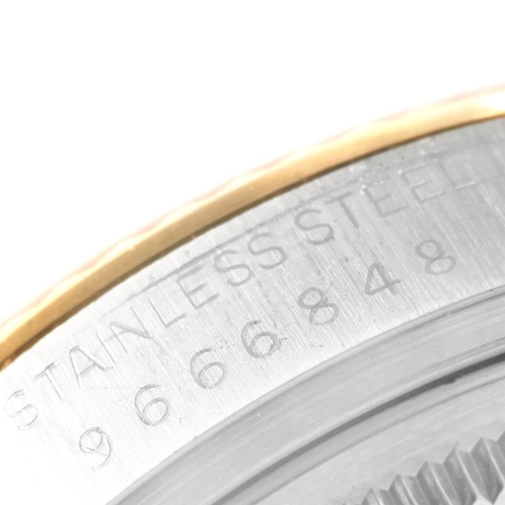 A close-up shot of the side bezel and engraved serial number on the Rolex Vintage Collection 16013 Men's Stainless Steel Champagne Dial 16013 Men's Stainless Steel Champagne Dial model watch.