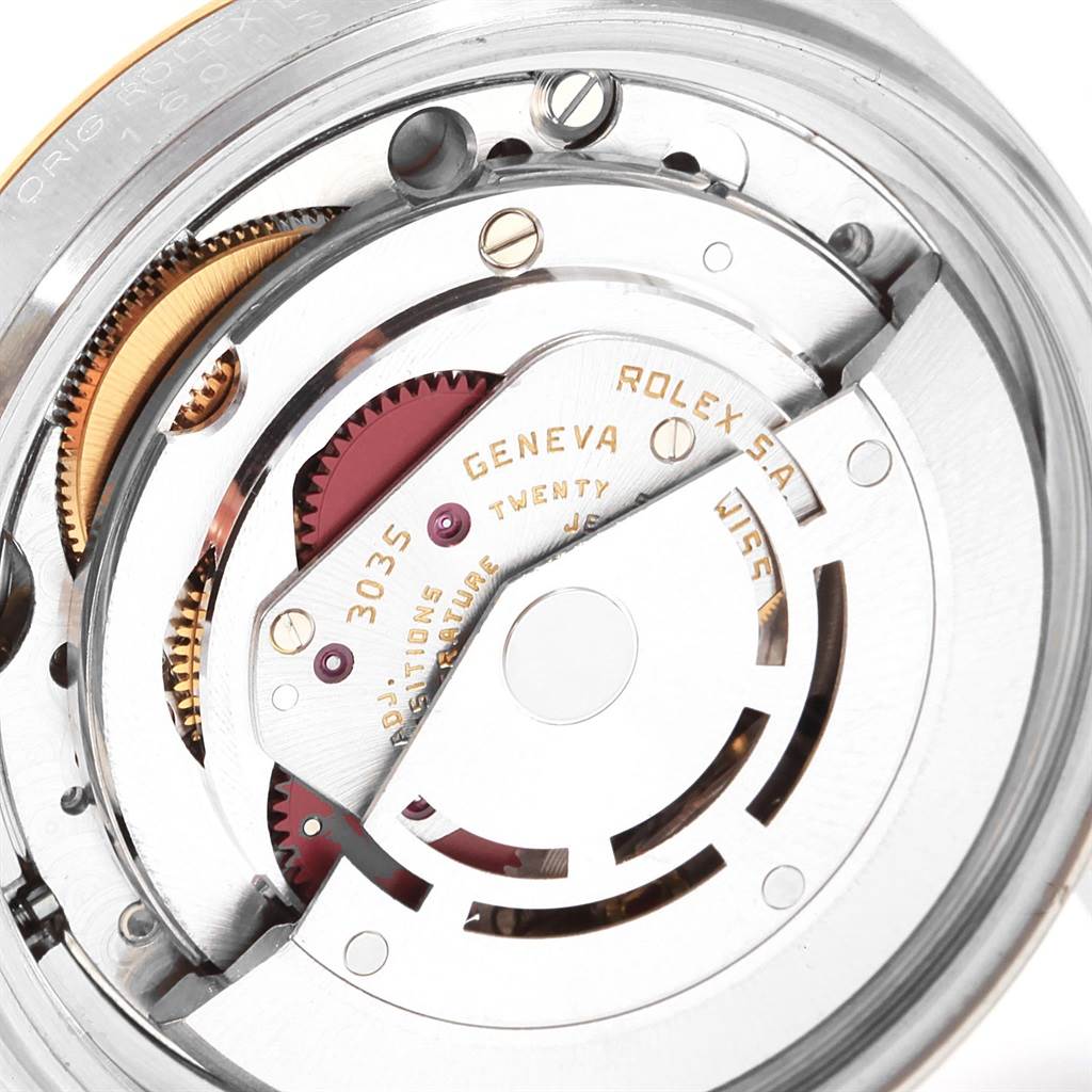 This image shows a close-up of the movement mechanism and intricate details of a Rolex Vintage Collection 16013 Men's Stainless Steel Champagne Dial 16013 Men's Stainless Steel Champagne Dial watch.