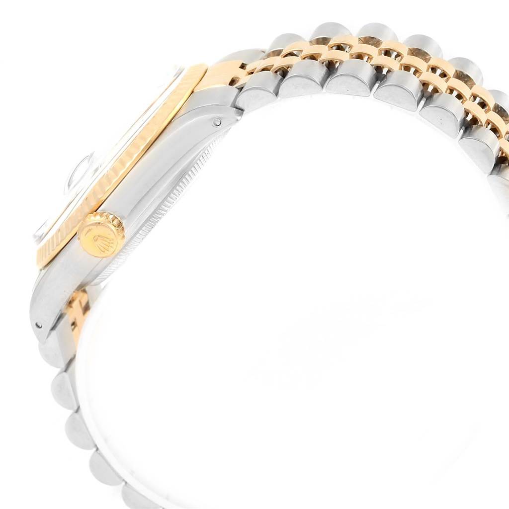 The image shows the side profile of a Rolex Vintage Collection 16013 Men's Stainless Steel Champagne Dial 16013 Men's Stainless Steel Champagne Dial watch, highlighting the crown and part of the two-tone bracelet.