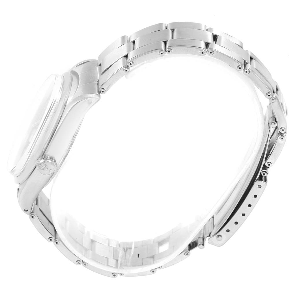 The image shows a side view of the Rolex Vintage Collection 1002 Men's Stainless Steel Silver Dial 1002 Men's Stainless Steel Silver Dial watch, highlighting the case and metal bracelet.