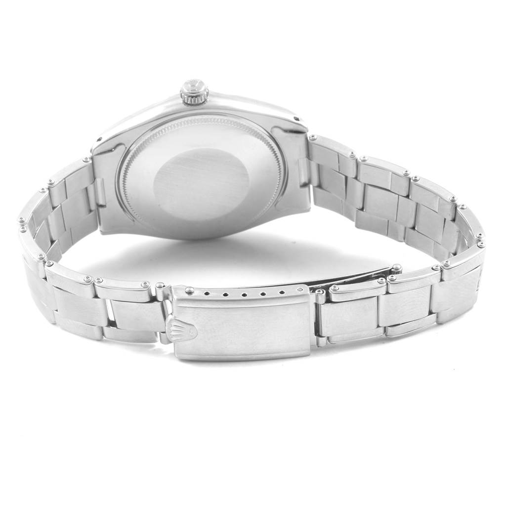 The image shows the back casing and bracelet clasp of the Vintage Collection model by Rolex from a rear angle.