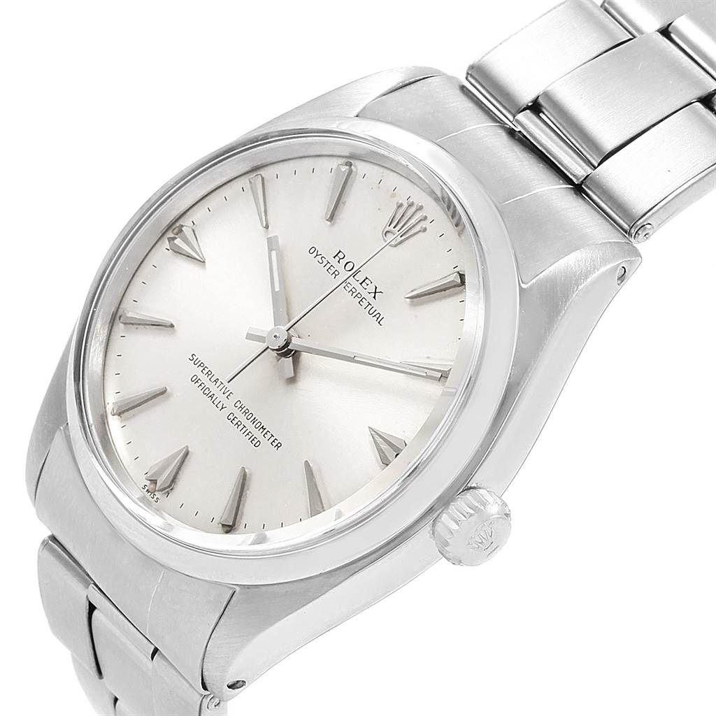 The Vintage Collection Rolex watch is shown from a three-quarter angle, displaying the face, bezel, crown, and part of the bracelet.