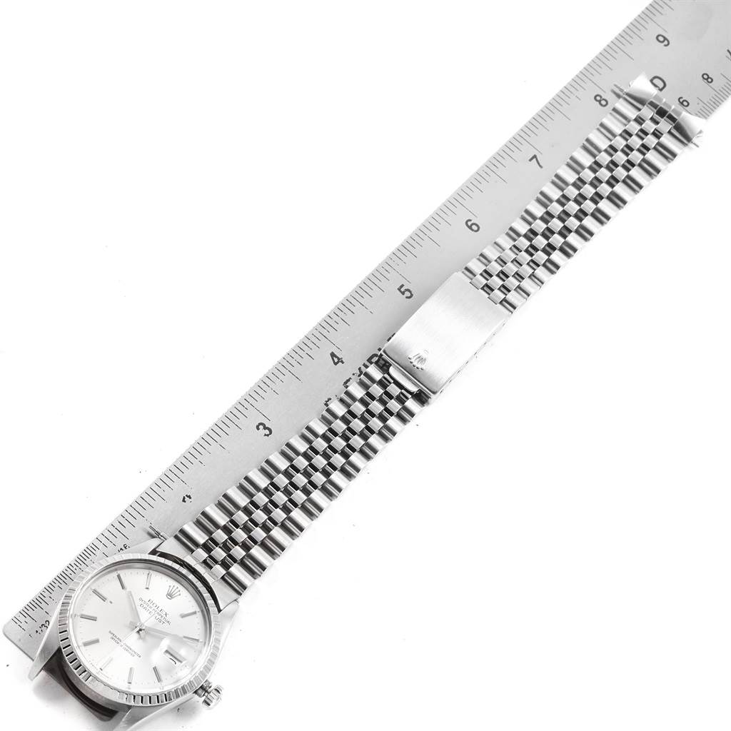 The image shows the Rolex Vintage Collection 16030 Men's Stainless Steel Silver Dial 16030 Men's Stainless Steel Silver Dial watch laid flat with a ruler beside it, highlighting the face, bracelet, and clasp.