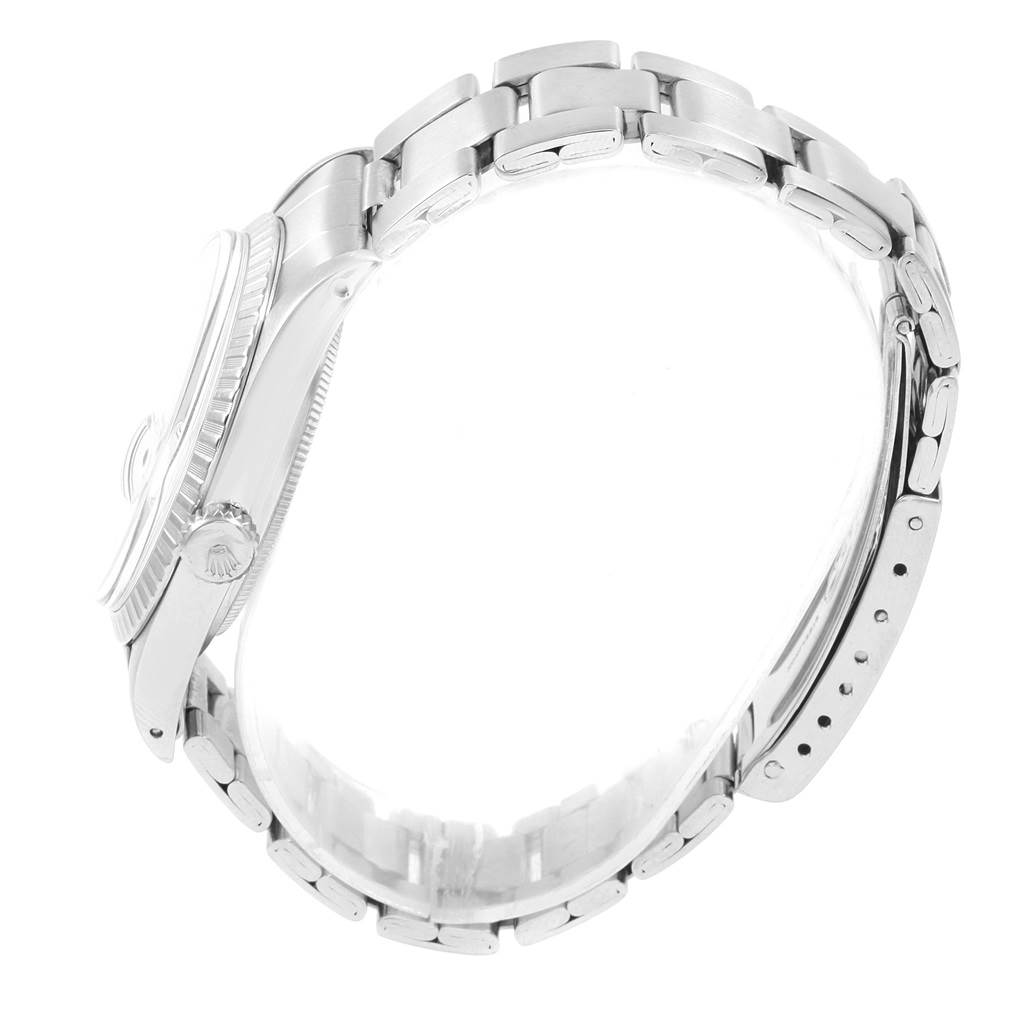 The image shows a side view of a Vintage Collection model by Rolex, highlighting the case, crown, and bracelet.