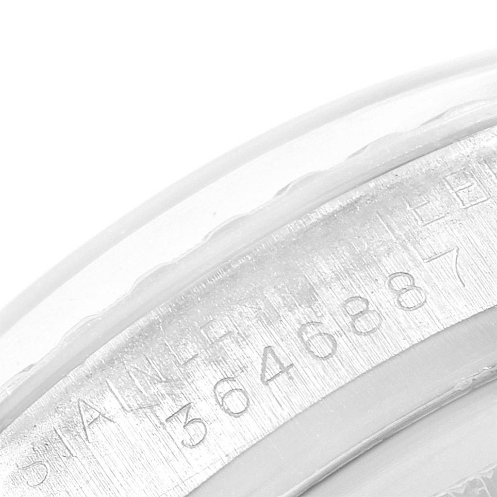 The image shows a close-up of the serial number engraving on a Rolex Vintage Collection 1603 Men
s Stainless Steel White Dial 1603 Men
s Stainless Steel White Dial model.