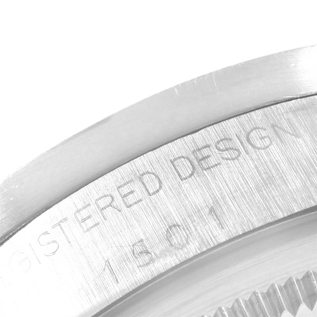 This image shows a close-up of the engraved back casing of a Rolex Vintage Collection 1501 Men
s Stainless Steel White Dial 1501 Men
s Stainless Steel White Dial model watch.