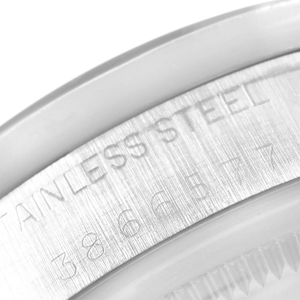 This image shows a close-up of the case back and edge inscriptions of a Rolex Vintage Collection 1501 Men
s Stainless Steel White Dial 1501 Men
s Stainless Steel White Dial model, highlighting the "Stainless Steel" engraving.