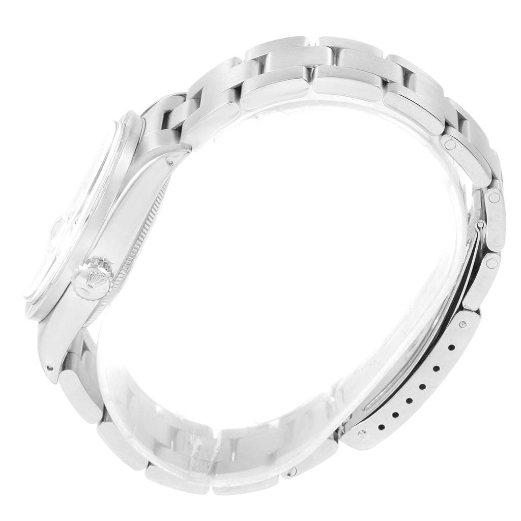 The image shows a side view of the Rolex Vintage Collection 1501 Men
s Stainless Steel White Dial 1501 Men
s Stainless Steel White Dial watch, focusing on the bracelet and crown.