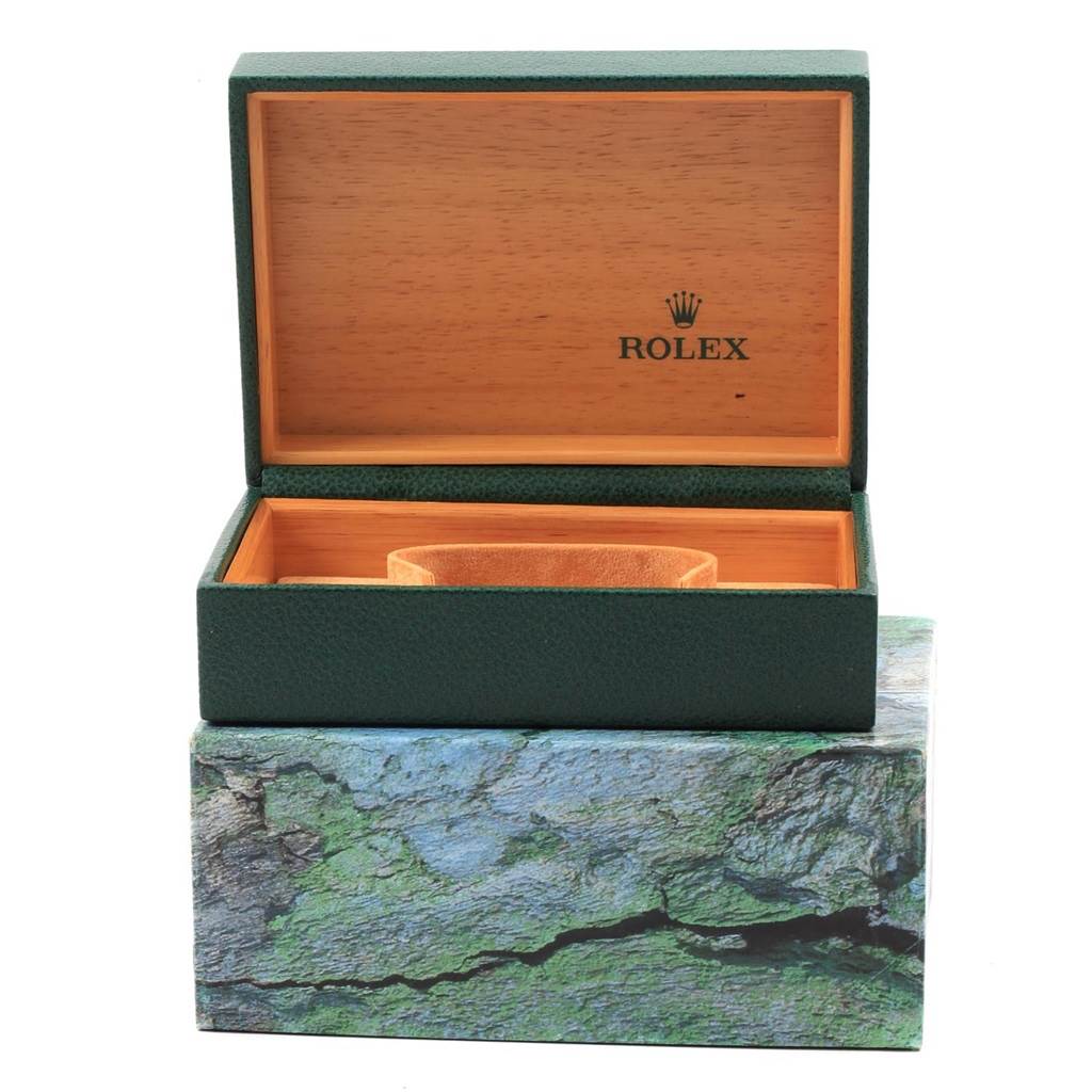 The image shows an open Rolex Vintage Collection 16013 Men's Stainless Steel Champagne Dial 16013 Men's Stainless Steel Champagne Dial watch box displaying the interior with a wooden and green leather design.