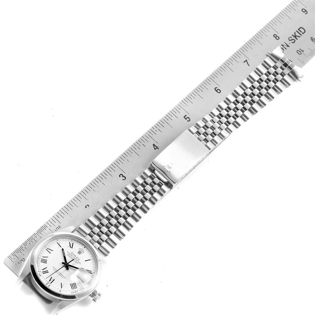 The image shows the Rolex Vintage Collection 16000 Men's Stainless Steel White Dial 16000 Men's Stainless Steel White Dial watch with a stainless steel bracelet and ruler for measurement.