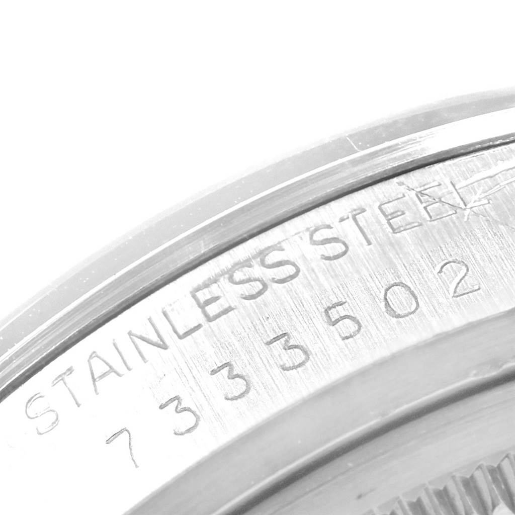This image shows a close-up of the stainless steel back case with serial numbers on a Vintage Collection model by Rolex.