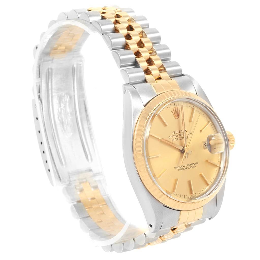 This image shows a Rolex Vintage Collection 16013 Men's Stainless Steel Champagne Dial 16013 Men's Stainless Steel Champagne Dial Datejust watch, angled to display the dial, bezel, and jubilee bracelet.