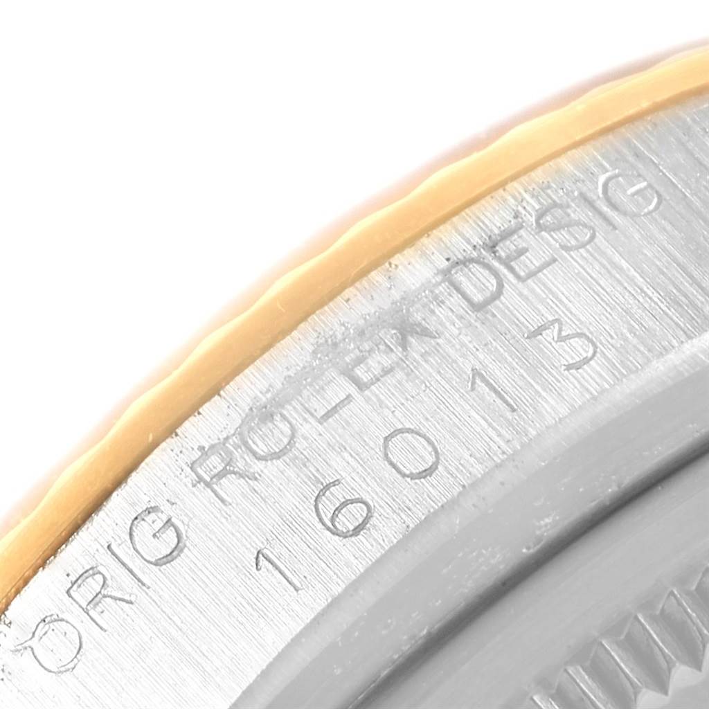 This close-up shows the engraved bezel and part of the case of the Rolex Vintage Collection 16013 Men's Stainless Steel Champagne Dial 16013 Men's Stainless Steel Champagne Dial model.