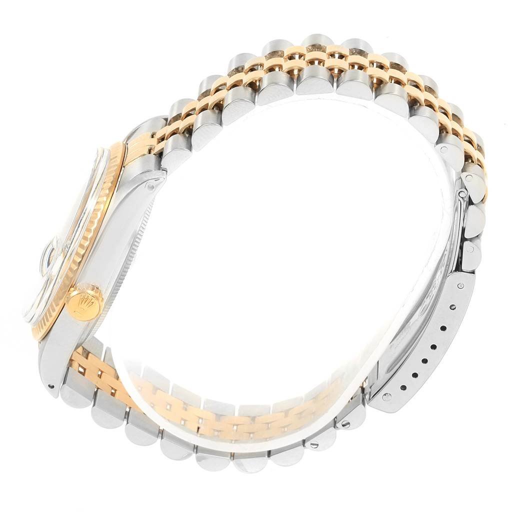 This image shows a side angle of the Rolex Vintage Collection 16013 Men's Stainless Steel Champagne Dial 16013 Men's Stainless Steel Champagne Dial model, highlighting the watch case, crown, and two-tone bracelet.