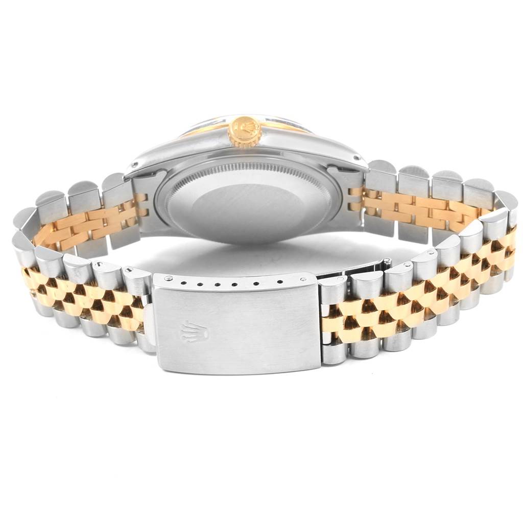 The image shows the back view of a Rolex Vintage Collection 16013 Men's Stainless Steel Champagne Dial 16013 Men's Stainless Steel Champagne Dial watch, highlighting the case back and the metal bracelet clasp.