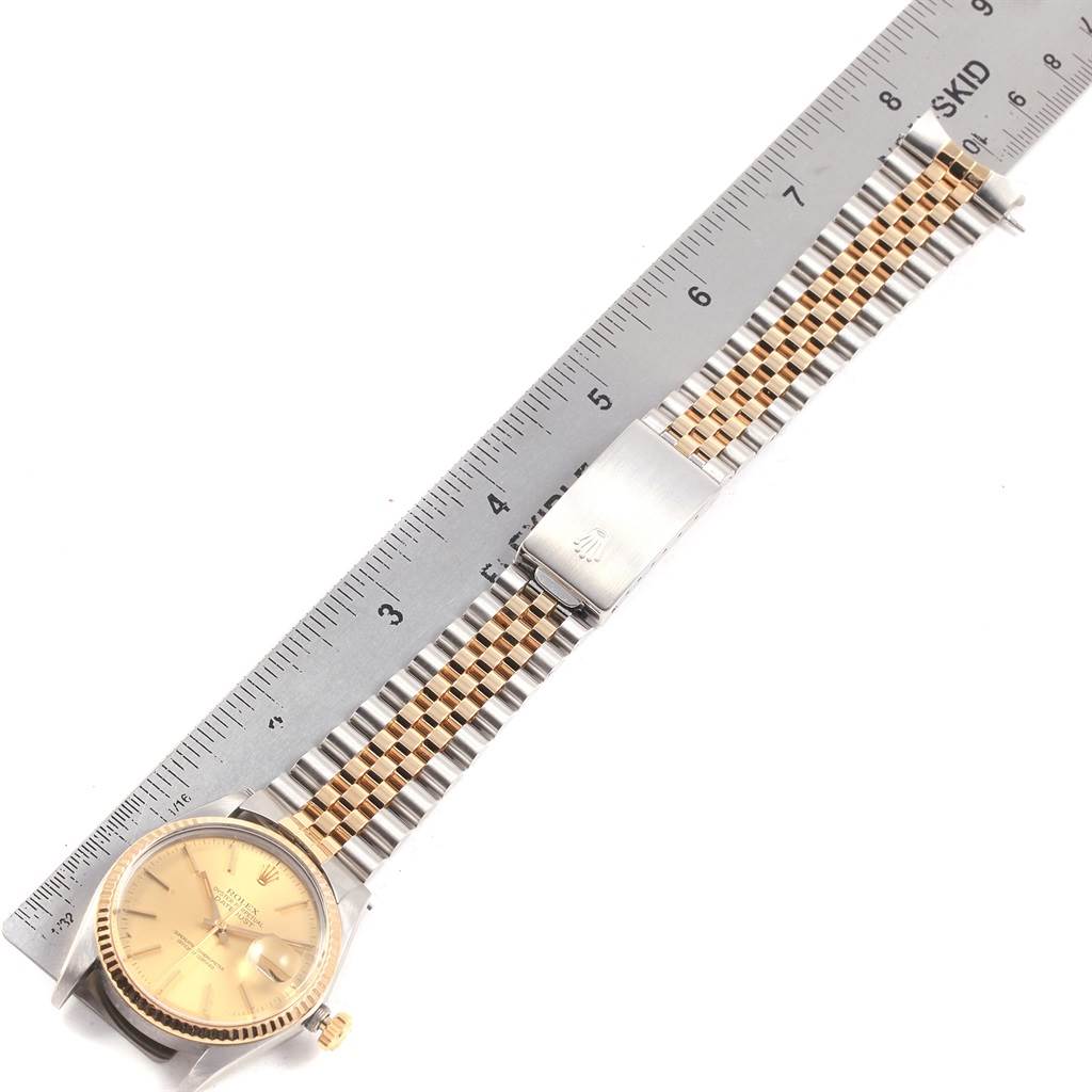 The image shows a Rolex Vintage Collection 16013 Men's Stainless Steel Champagne Dial 16013 Men's Stainless Steel Champagne Dial watch from a top-down angle, including the face, crown, and strap, with a ruler measuring the strap length.