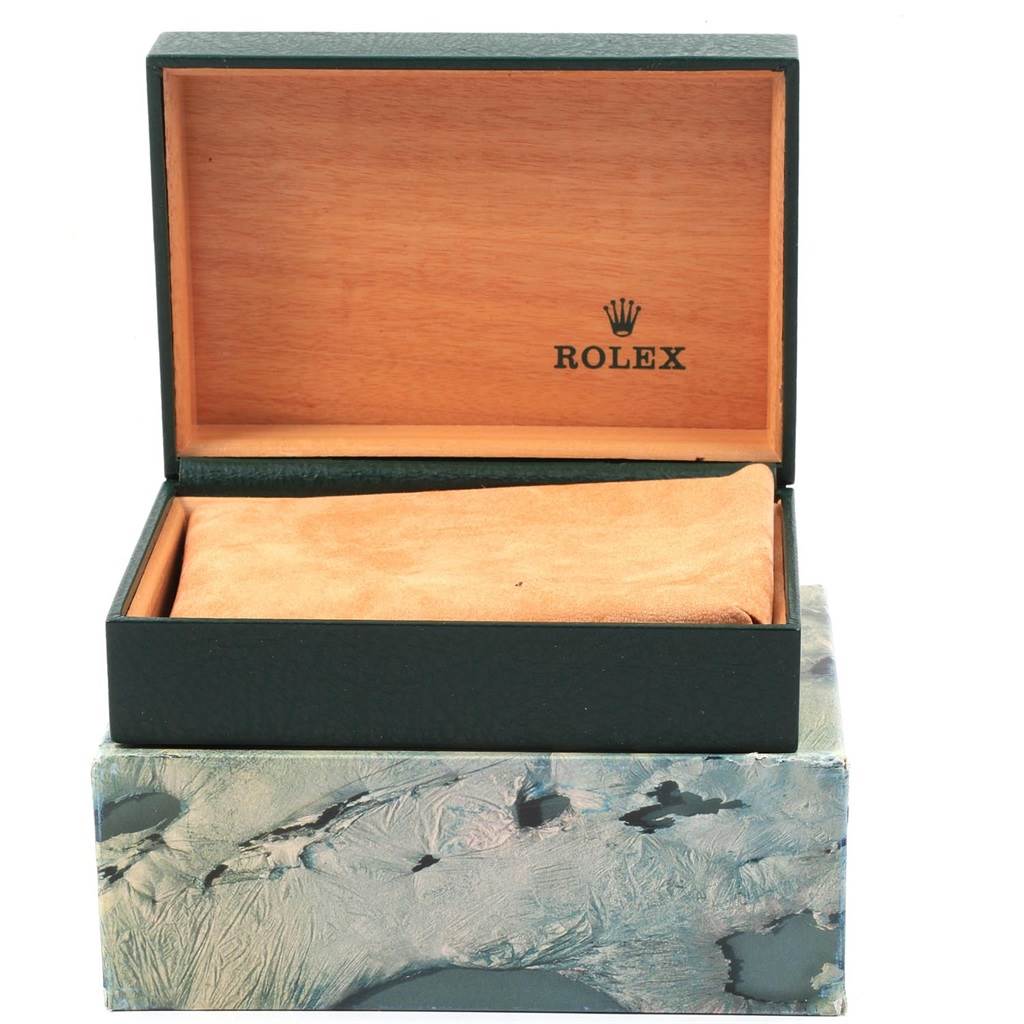 This image shows the open box for the Vintage Collection model watch by Rolex, with the watch presumably inside.