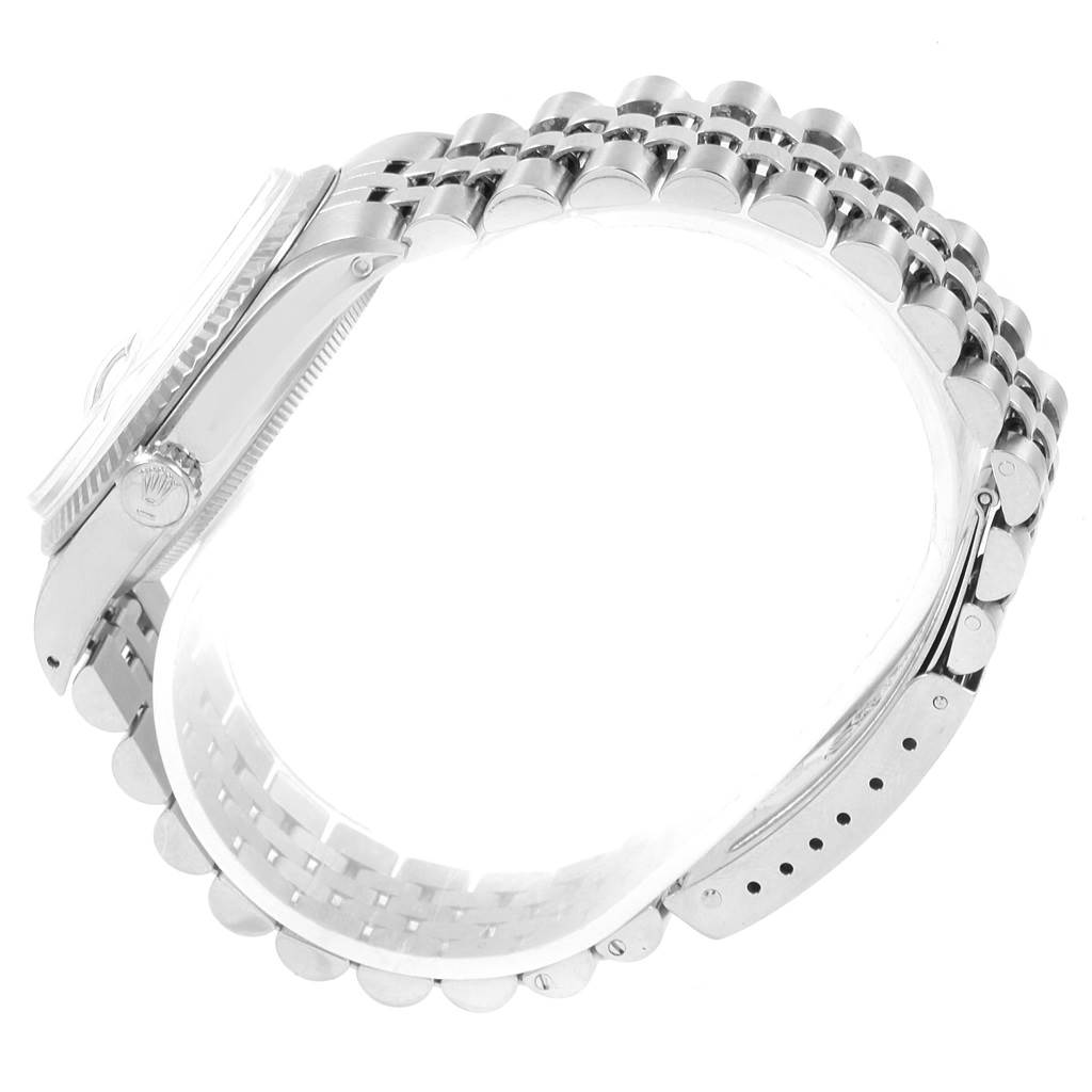 The image shows a side angle of a Rolex Vintage Collection 16014 Men's Stainless Steel Silver Dial 16014 Men's Stainless Steel Silver Dial watch, focusing on the side case, crown, and metal bracelet.