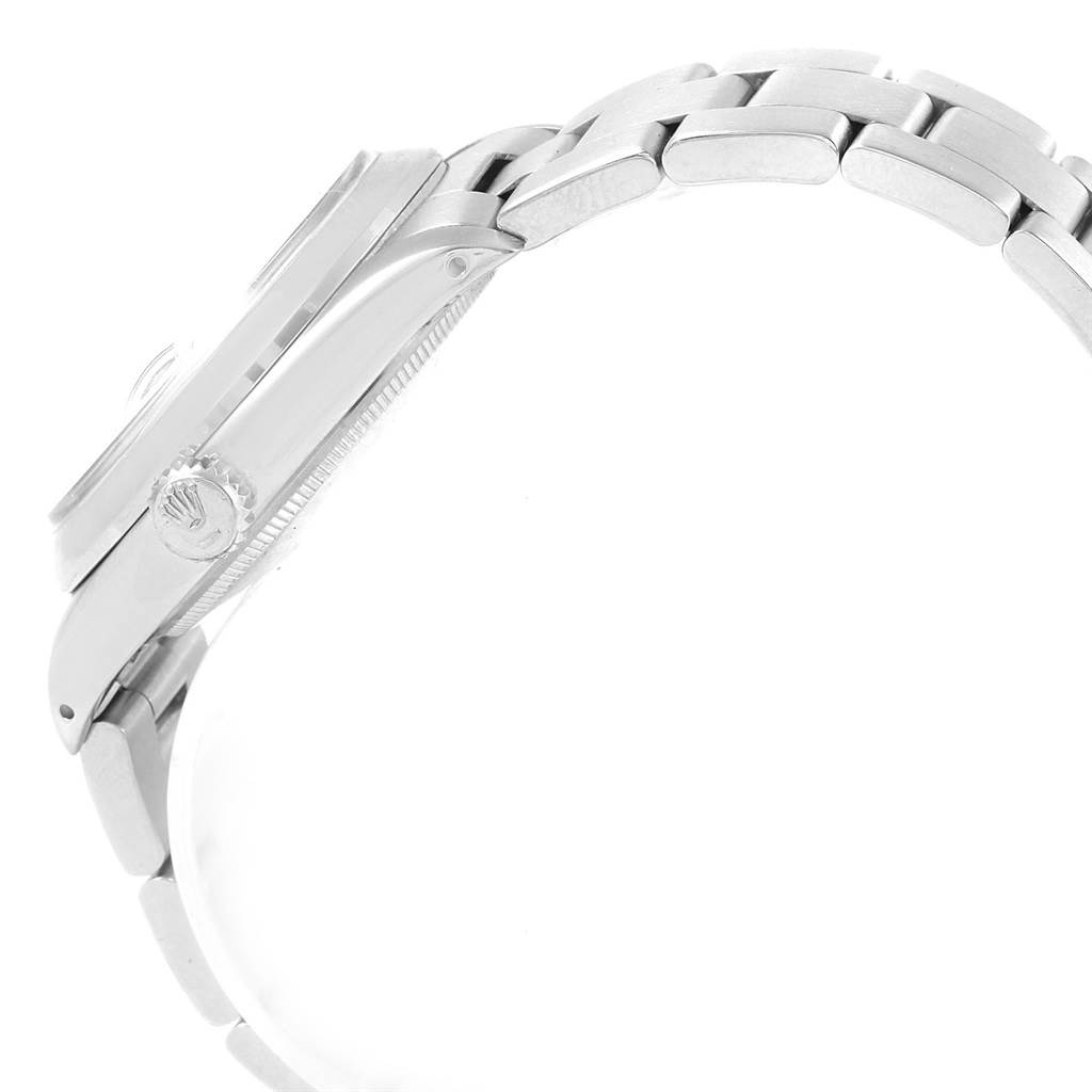 The image shows a side view of the Rolex Vintage Collection 1501 Men's Stainless Steel Blue Dial 1501 Men's Stainless Steel Blue Dial watch focusing on the crown and bracelet links.