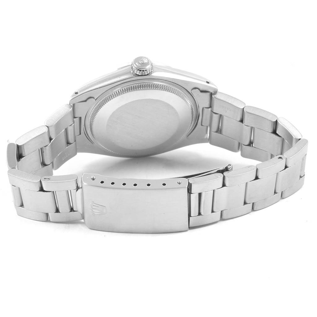 This image shows the underside view of the Rolex Vintage Collection 1501 Men's Stainless Steel Blue Dial 1501 Men's Stainless Steel Blue Dial watch, highlighting its clasp, bracelet, and case back.