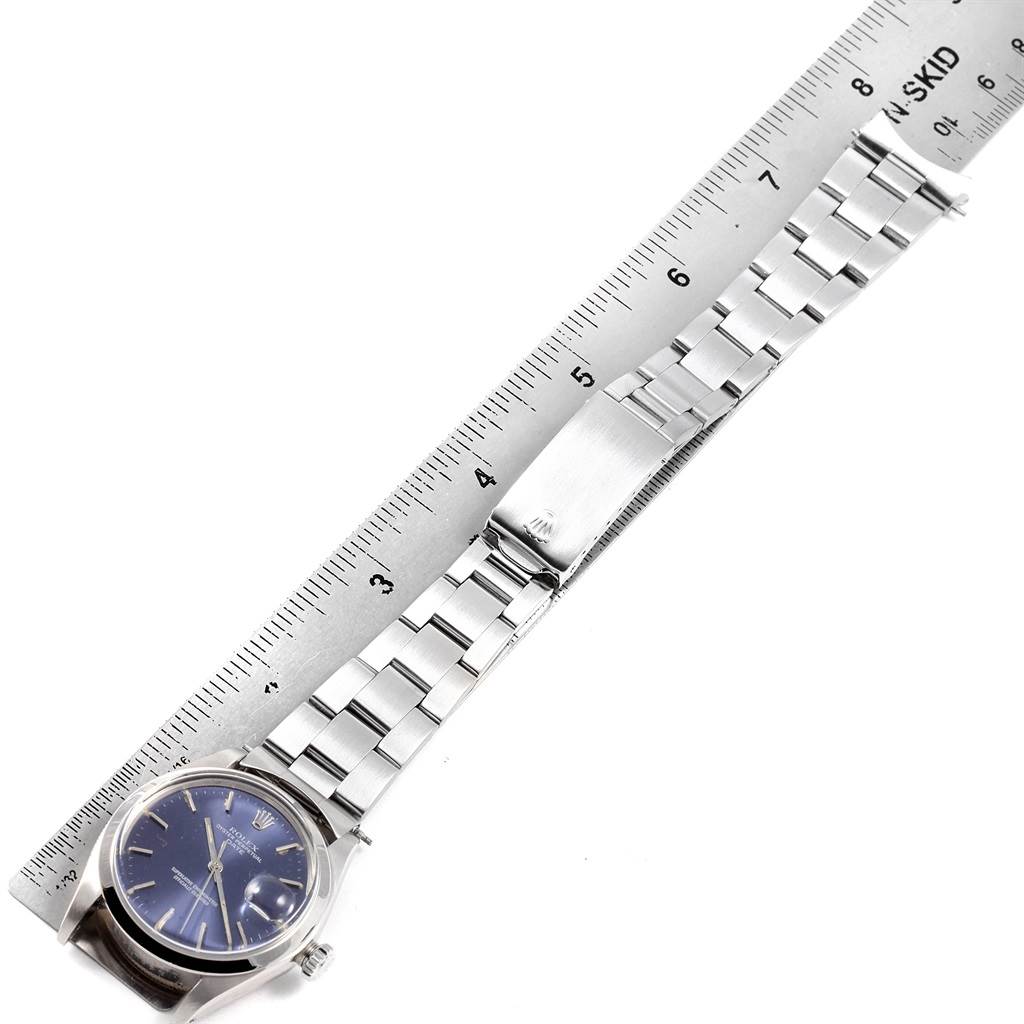 The image shows the Rolex Vintage Collection 1501 Men's Stainless Steel Blue Dial 1501 Men's Stainless Steel Blue Dial watch laid flat with its bracelet extended and a ruler for size reference.