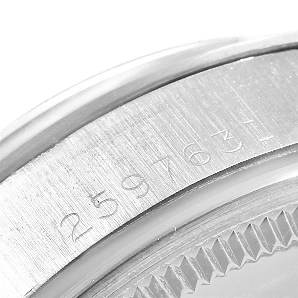 This close-up image shows the engraved serial number on the case of a Vintage Collection Rolex watch.