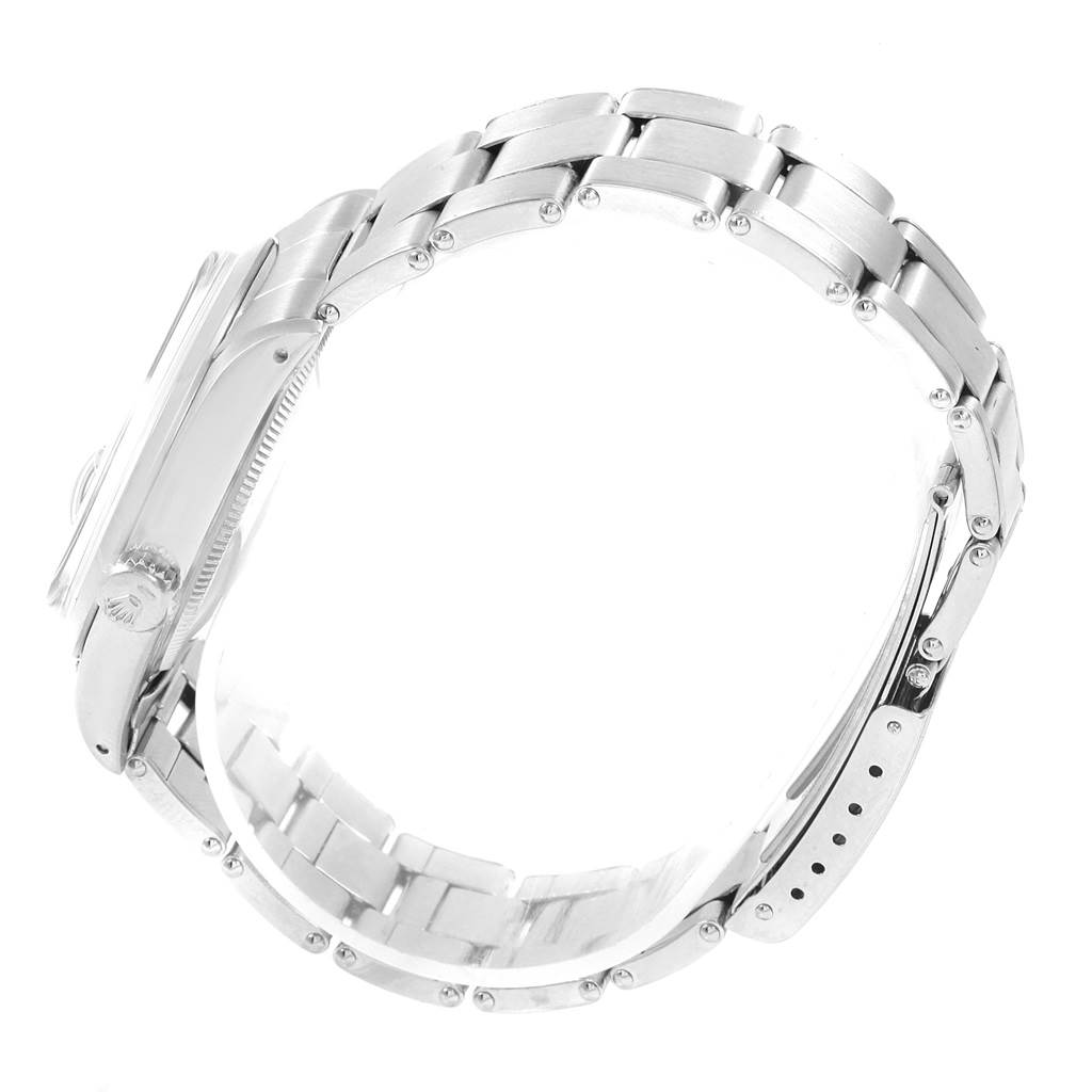 The image shows a side angle of a Rolex Vintage Collection 1500 Men's Stainless Steel Silver Dial 1500 Men's Stainless Steel Silver Dial watch, highlighting its case, crown, and metal bracelet.