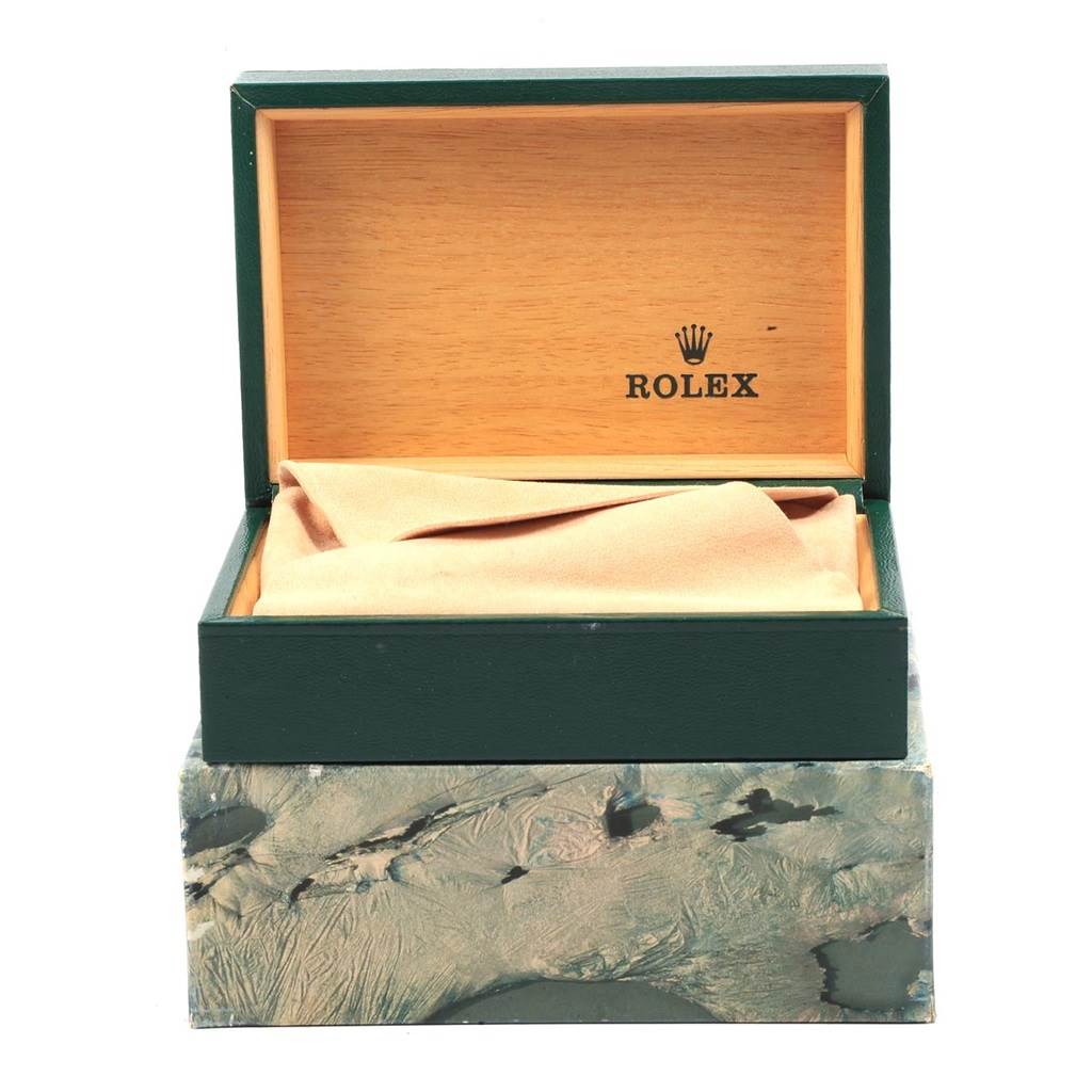 The image shows an open Rolex watch box from the Vintage Collection, revealing the interior and a cloth.
