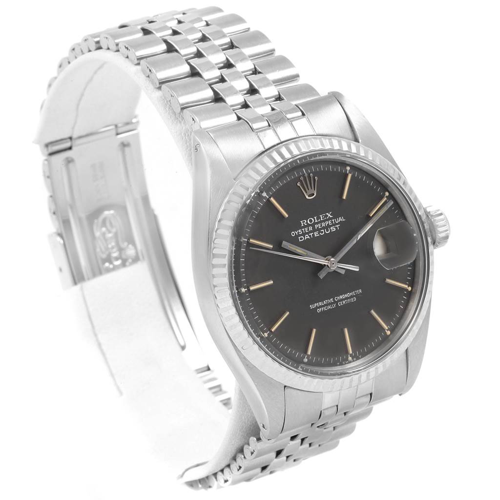 The Vintage Collection Rolex watch is shown at a three-quarter angle, displaying its face, bezel, and bracelet.