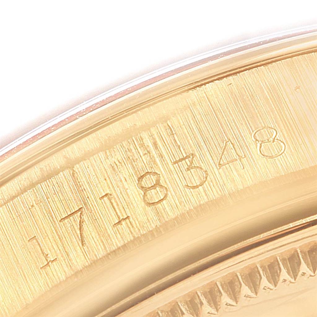 The image shows a close-up of the serial number engraved on the gold case back of a Rolex Vintage Collection 1500 Men's Yellow Gold Silver Dial 1500 Men's Yellow Gold Silver Dial watch.