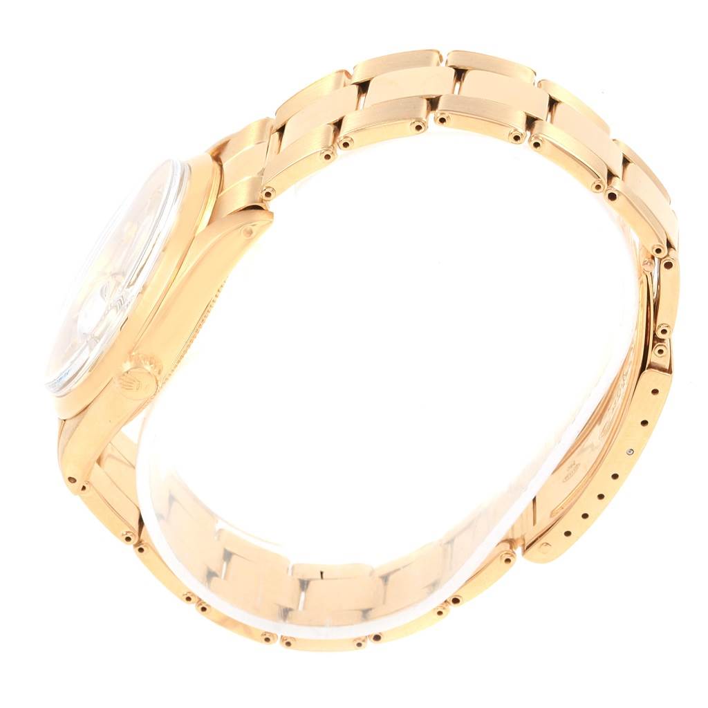 This side view of the Rolex Vintage Collection 1500 Men's Yellow Gold Silver Dial 1500 Men's Yellow Gold Silver Dial model showcases its gold bracelet and case with a partially visible crown.