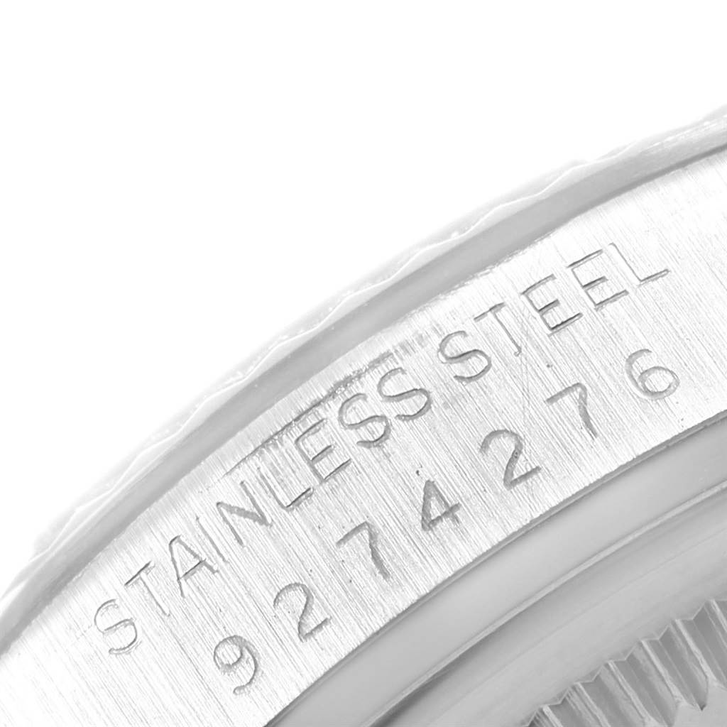 The image shows a close-up of the stainless steel case area with engraved text on a Rolex Vintage Collection 16014 Men's Stainless Steel Silver Dial 16014 Men's Stainless Steel Silver Dial watch.