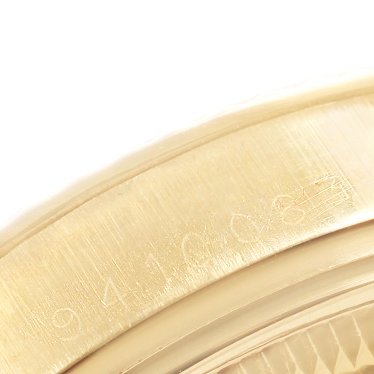 This close-up image of the Rolex Vintage Collection 15037 Men
s Yellow Gold Champagne Dial 15037 Men
s Yellow Gold Champagne Dial watch shows the serial number engraved on the watch case.