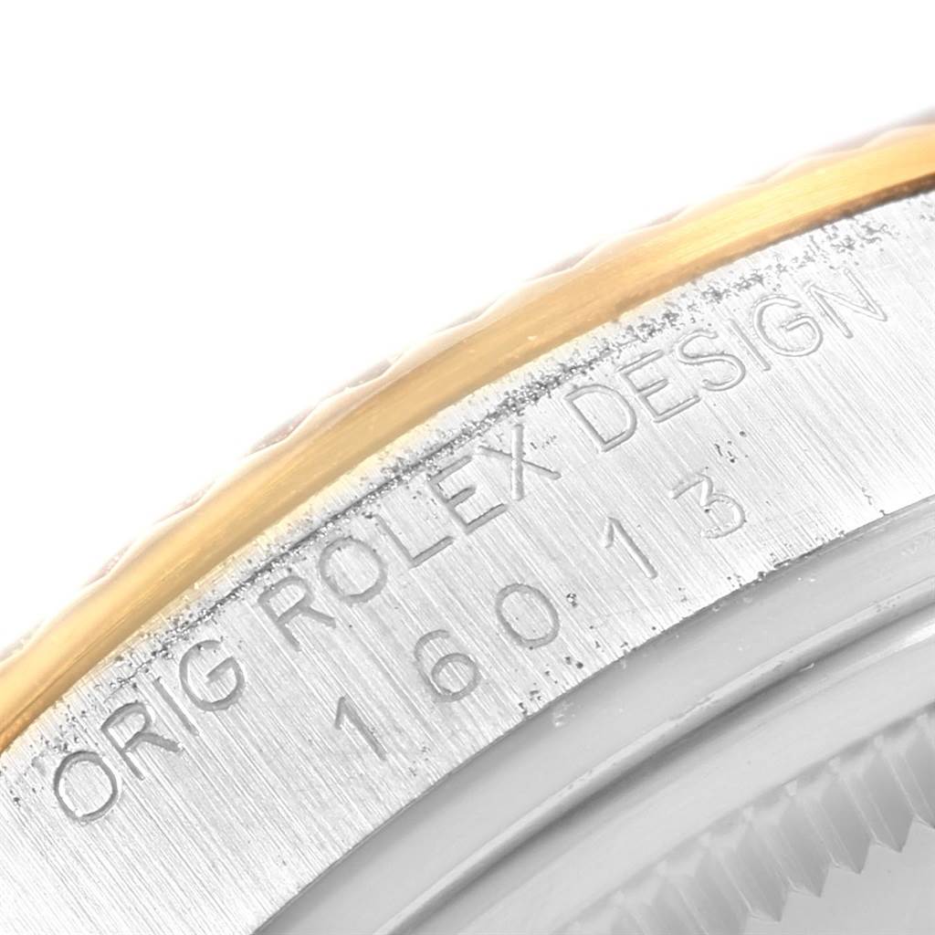 This close-up angle of the Rolex Vintage Collection 16013 Men
s Stainless Steel Champagne Dial 16013 Men
s Stainless Steel Champagne Dial model shows the engraved text and edge of the metal case.