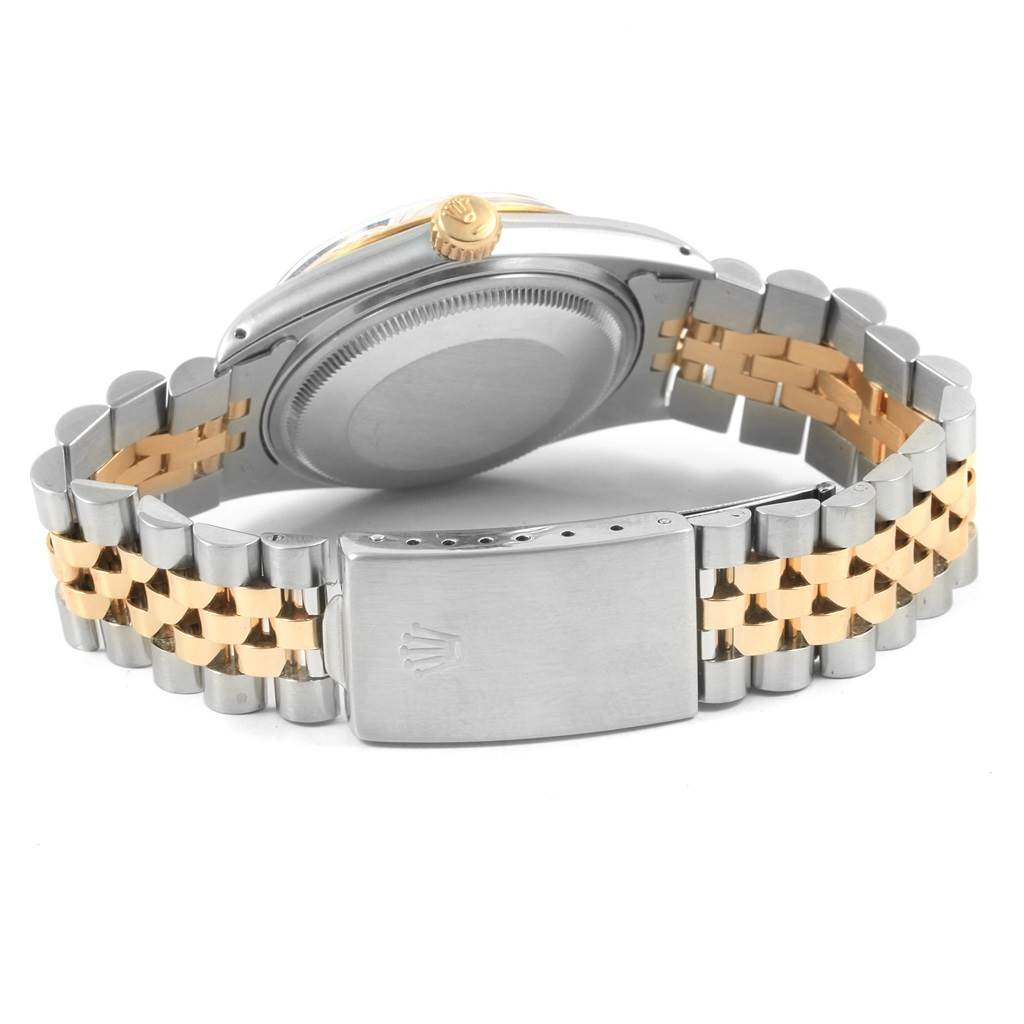 The image shows the back view of a Rolex Vintage Collection 16013 Men's Stainless Steel White Dial 16013 Men's Stainless Steel White Dial watch, highlighting its clasp, bracelet, and case back.