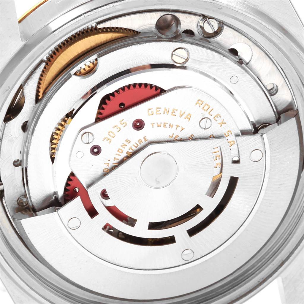 The image shows the internal mechanism of a Vintage Collection Rolex watch from an angled close-up view.